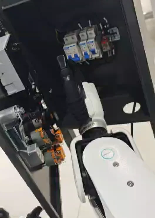 Robot gripper contacting the blue internal air-breaker bank